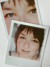 Polaroids of Justine scattered on a table