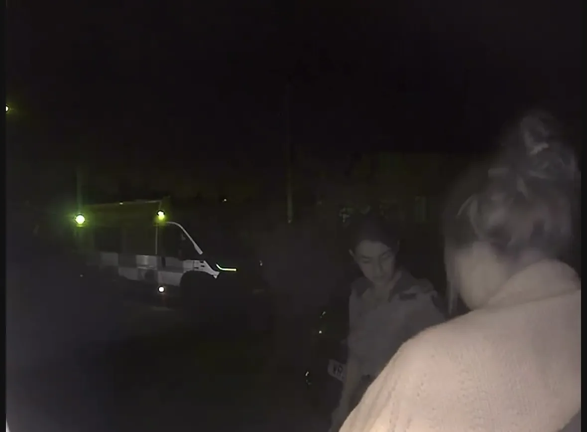Ring doorbell footage of me walking to the ambulance in the night.